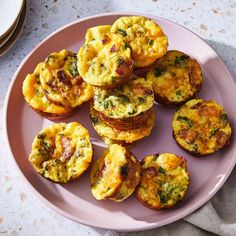 a pink plate topped with mini muffins covered in broccoli and cheese