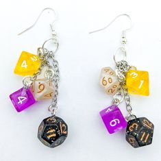 two pairs of dice earrings with numbers on them