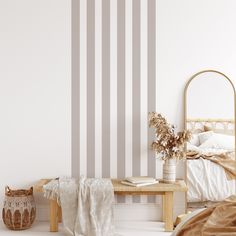 a white and grey striped wall in a bedroom