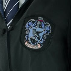 a harry potter school uniform with a hogwarts crest on it