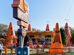 an amusement park with lots of orange cone shaped structures