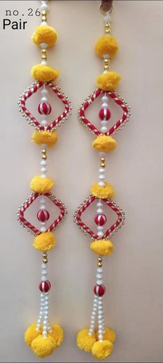 the earrings are decorated with beads and pearls