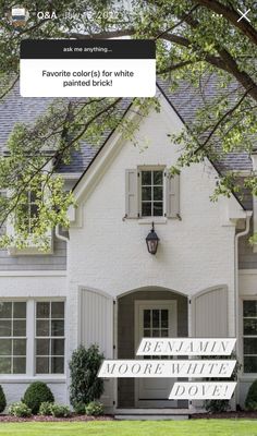 a white house with windows and shutters in front of it that says, favorite cultural home painted brick