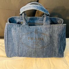 Nwt Good Condition Minor Discoloration Due To Use. Luxury Denim Bags With Double Handle, Luxury Denim Bag With Double Handles, Luxury Denim Shoulder Bag With Double Handle, Luxury Denim Tote Bag, Designer Denim Travel Bag, Luxury Denim Double Handle Shoulder Bag, Luxury Denim Tote Shoulder Bag, Luxury Denim Bags For Shopping, Blue Luxury Bag With Pockets