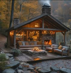 a cabin in the woods is lit up with candles and lights on it's porch