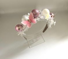 🎄Christmas tinsel headbands with baubles and butterfly. 🎄These Alice bands are lightweight and comfy to wear. With added white snowflake  tinsel and cute pastel pink and white small baubles and a pink butterfly on the top. 🎄These cute headbands are great for getting into the festive spirit.  🎄Add with your favourite Christmas jumper or on it's own, it's a great timeless statement piece that you can wear year after year.   🎄Only a limited amount of each design are made.  🎄Suitable for ages 5-100 Butterfly Christmas, Alice Bands, Headband Crown, Christmas Tinsel, Christmas Headband, Alice Band, Cute Headbands, Cute Pastel, Christmas Jumper