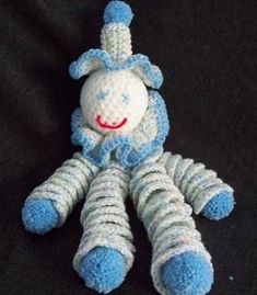 a crocheted blue and white stuffed animal