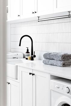 White laundry cabinets and a Turner Hastings Novi 50 x 46 Fine Fireclay Butler Sink in white. The cabinetry handles are black as is the tapware. Kitkat Tiles, Butler Kitchen, White Laundry, Black Taps, Butler Sink, Blue Space, Space Interiors, Laundry Sink, White Sink