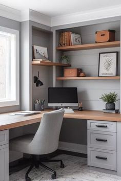 a home office with gray walls and wooden shelves