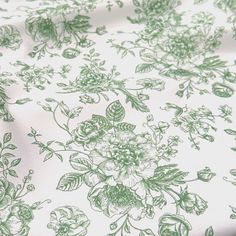 a green and white floral print fabric