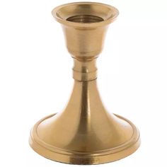 a brass colored candle holder on a white background