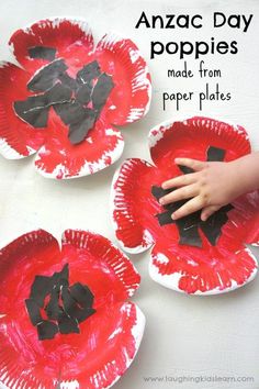 three paper plates that have black and red flowers on them, with the words anzac day poppies made from paper plates