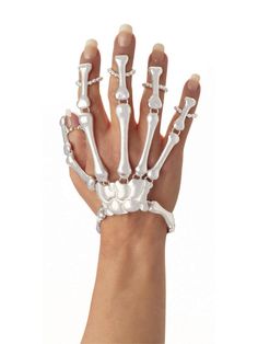 PRICES MAY VARY. Hand skeleton detail bracelet with wrist and finger straps Pearl white bone hand skeleton accessory with hinged finger bone design for comfortable movement Important: costumes are sized differently than apparel, use the Forum women's Standard adult size; and read reviews before purchase, do not choose based on age or clothing size Pair with Forum other bone collection costume accessories to create your desired look Forum Novelties has been providing quality costumes and accessor Skeleton Hand Bracelet, Halloween Skeleton Hand, Women Skeleton, Skeleton Halloween Costume, Bones Bracelet, Skeleton Skull, Skull Hand