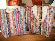 two multicolored bags sitting on top of a wooden table next to each other