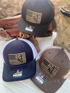 The perfect gift for your American lineman! We are loving the quality and look of these Richardson 112 SnapBack adjustable caps. Lineman Patch is laser engraved and then permanently adhered to the hat.  One size fits most! Choose from solid black, brown and tan or navy and white!  Hats ship in a box! Background props not included. Lineman Gifts, White Hats, Son Quotes, Patch Hat, Brown Hats, Flag Patches, Guy Stuff, Boyfriend Birthday, Colorado Springs