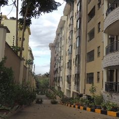 an empty street lined with apartment buildings