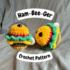 two small crocheted hamburgers are sitting on a bed with the words ham - bee - ger written above them