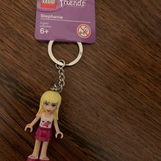 a key chain with a lego girl figure on it