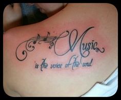 music is the voice of the soul with musical notes tattoo on back shoulder for women