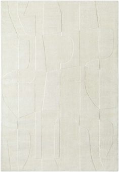 a white rug with abstract shapes on it