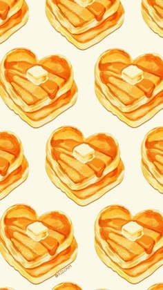 pancakes in the shape of heart with butter and syrup on them, seamless background