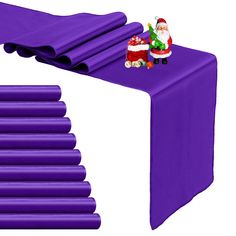 a purple table cloth with santa clause on it