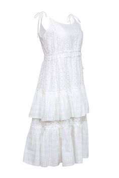 Elevate your summer style with a dreamy dress by Rachel Antonoff. The charming bohemian design in crisp white cotton exudes a feminine feel with its intricate eyelet lace. Romantic ruffled tiers and tie shoulder straps complete this charming midi. Perfect for any occasion, pair it with a woven sandal and crossbody for a lovely look. Size L 100% Cotton (exl. trim) Lined Pullover Tie shoulder straps Bateau neckline Tiered & ruffled Bust 36" Waist 44" Shoulder to hem 45"