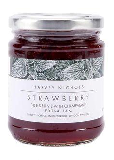 a jar of strawberry jam on a white background