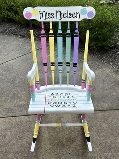 a colorful wooden rocking chair that says miss nelson