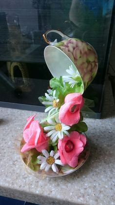 pink and white flowers in a glass bowl