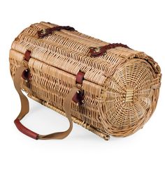 a wicker bag with brown leather straps