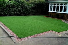 an artificial lawn in front of a house