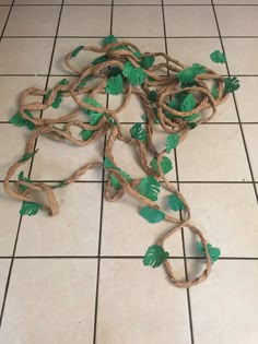 a bunch of vines that are sitting on the floor in front of a tiled floor