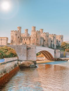 an old castle with a bridge over the water