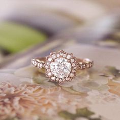 a diamond ring sitting on top of a table