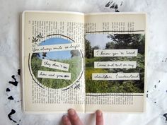 an open book with pictures and words on it, in the middle of someone's hand