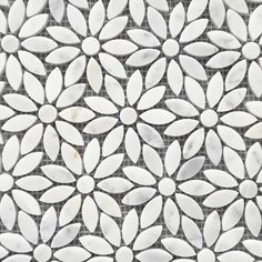 a white and black tile pattern with leaves on the bottom, as well as an image of