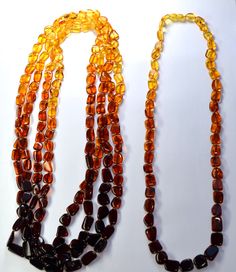 Baltic Amber Rainbow Square Bead Necklace Natural Baltic Amber Bead Strand/Necklace, beads are square-rectangle shaped and range from 9X8X5mm-20X11X4mm. One Necklace is 27" in length. A Rainbow of Baltic Amber Bead Colors! There is a small plastic screw clasp in the back. You will receive One Necklace! Made in Lithuania. Arrives to your home with the "All About Amber" Brochure which includes care instructions! Thank you for looking! Baltic Clothing, Amber Bead Necklace, Baltic Amber Jewelry, Necklace Beads, Amber Ring, Amber Necklace, Amber Beads, Square Bead, Amber Jewelry