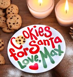 cookies for santa love me on a plate next to candles