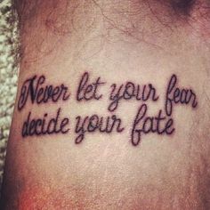 a tattoo saying never let your fear decide your fate