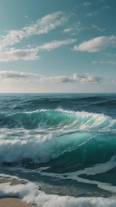 an ocean view with waves crashing on the shore and clouds in the sky over the water