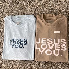 Bundle Of Two Jesus Loves You Company T-Shirts! Both Are Size Medium! Brown Is Brand New And The Blue Was Just Tried On But Never Worn. Retail At $38 Each And The Mocha/Blush Is Sold Out! Cute Designs For Shirts, Bible T Shirt Design, Christian Items To Sell, Christian Valentines Shirts, Cute Christian T Shirts, Cricut Projects Clothes, Jesus T Shirt, Christian Graphic Tees Design, Jesus Loves You Shirt