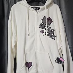 Nwt F21 X Hello Kitty Rhinestone Zip-Up Hoodie With Rubber Hello Kitty Decoration Size Medium Details From Our Hello Kitty And Friend's X Forever21 Collection, This Fleece Zip-Up Hoodie Features Front And Back " Hello Kitty " Text And Character Graphics Rhinestones Embellishments A Drawstring Hood Long Sleeves Split Kangaroo Pocket And Ribbed Trim 2023 Sanrio Co.Ltd Sold Out Online From Smoke Free Home White Y2k Streetwear Outerwear, White Y2k Outerwear For Streetwear, White Y2k Style Streetwear Outerwear, Y2k White Cotton Outerwear, White Cotton Y2k Outerwear, Sanrio Hoodie, Hello Kitty Text, Hello Kitty Rhinestone, Hello Kitty Decorations