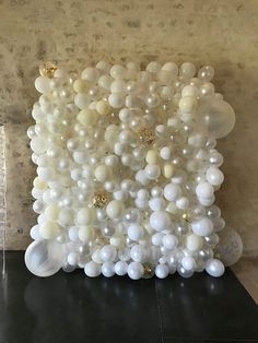 an art piece made out of balloons and pearls