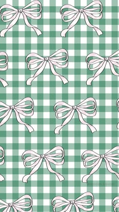 a green and white checkered pattern with bows