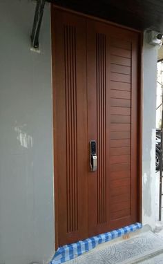 a large wooden door on the side of a building