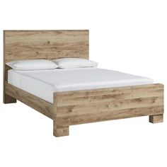 a wooden bed with white sheets and pillows