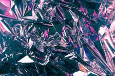 an abstract photo of purple and pink tinfoiled material with lots of metallic foil on it