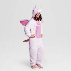 a woman in a pink unicorn costume