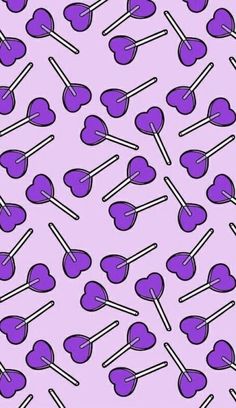 purple hearts and lollipops on a pink background